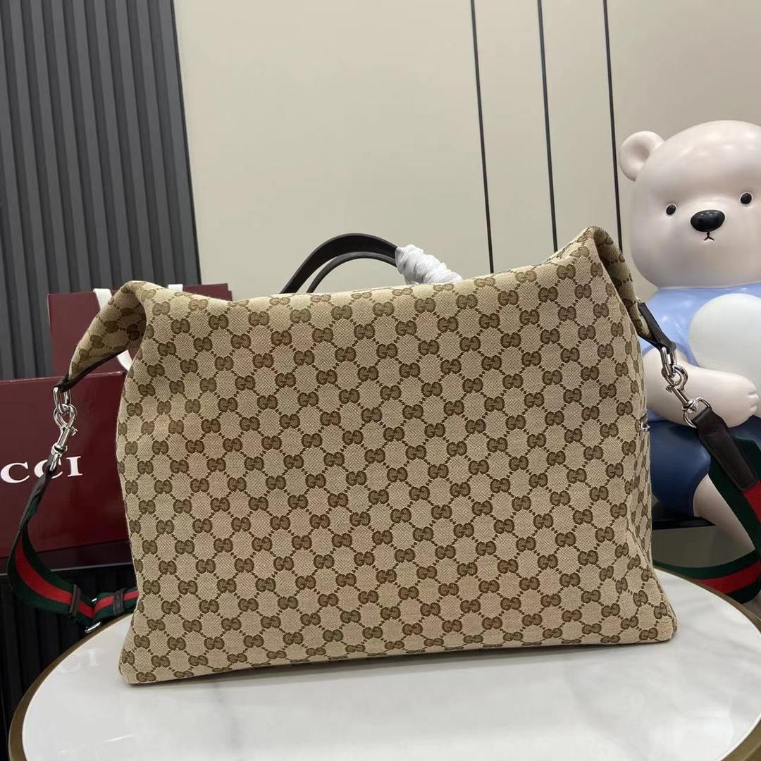 Gucci GG Canvas Medium Duffle Bag - DesignerGu