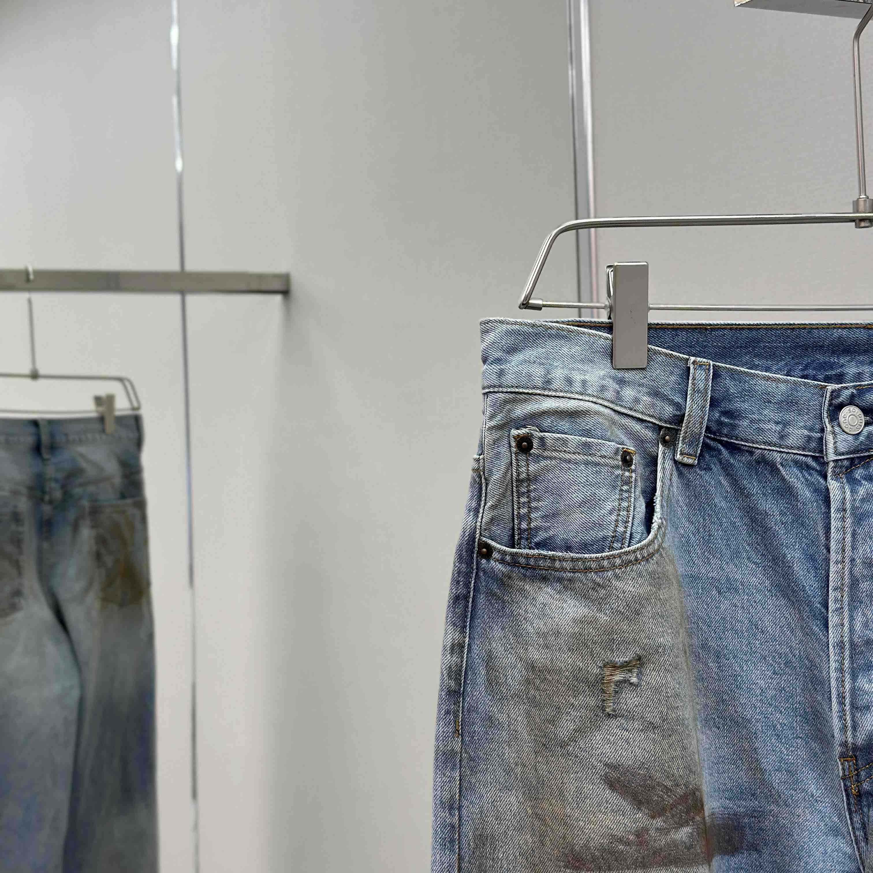 Acne Studios Mud-dyed torn jeans - DesignerGu