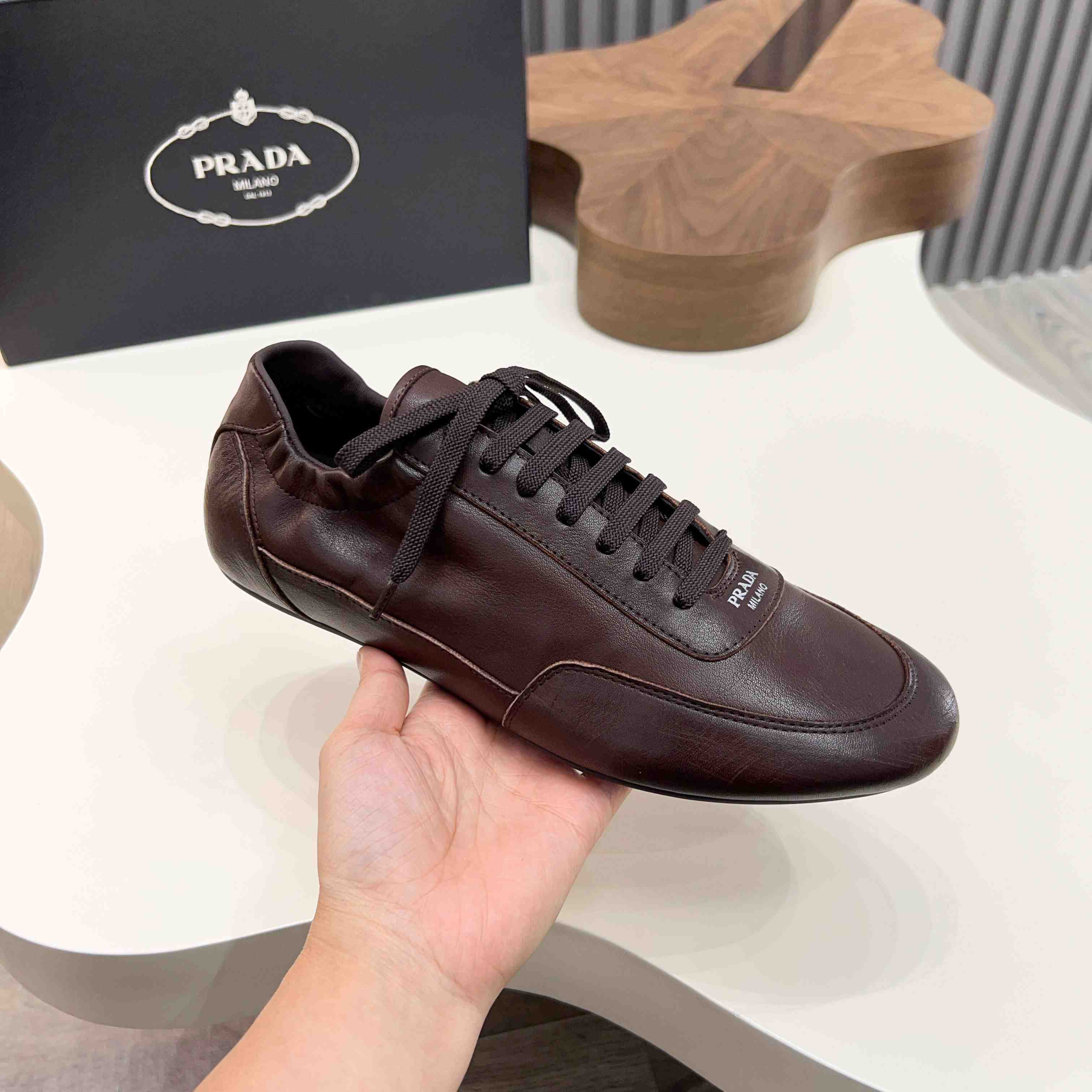 Prada Collapse Leather Sneakers - DesignerGu