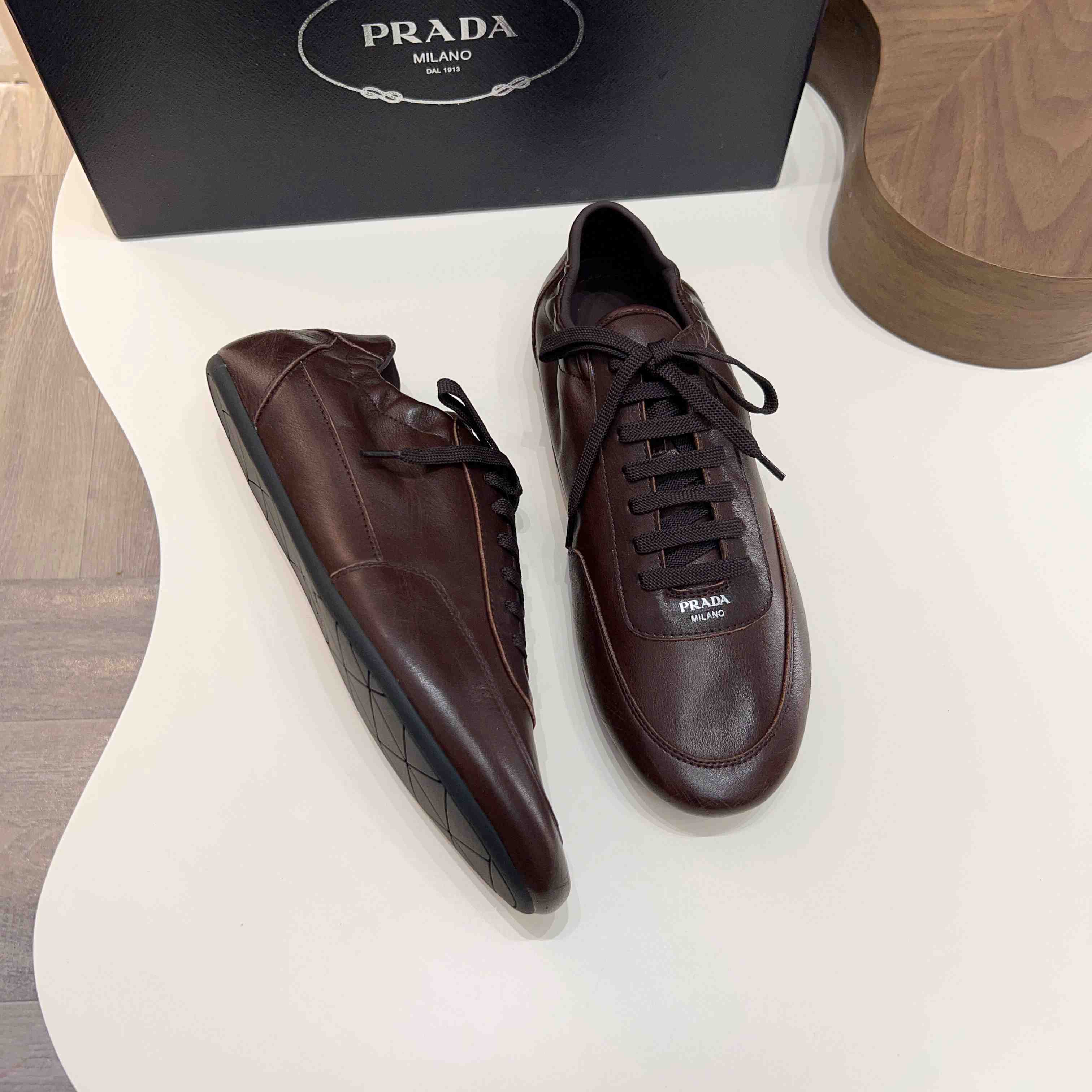 Prada Collapse Leather Sneakers - DesignerGu