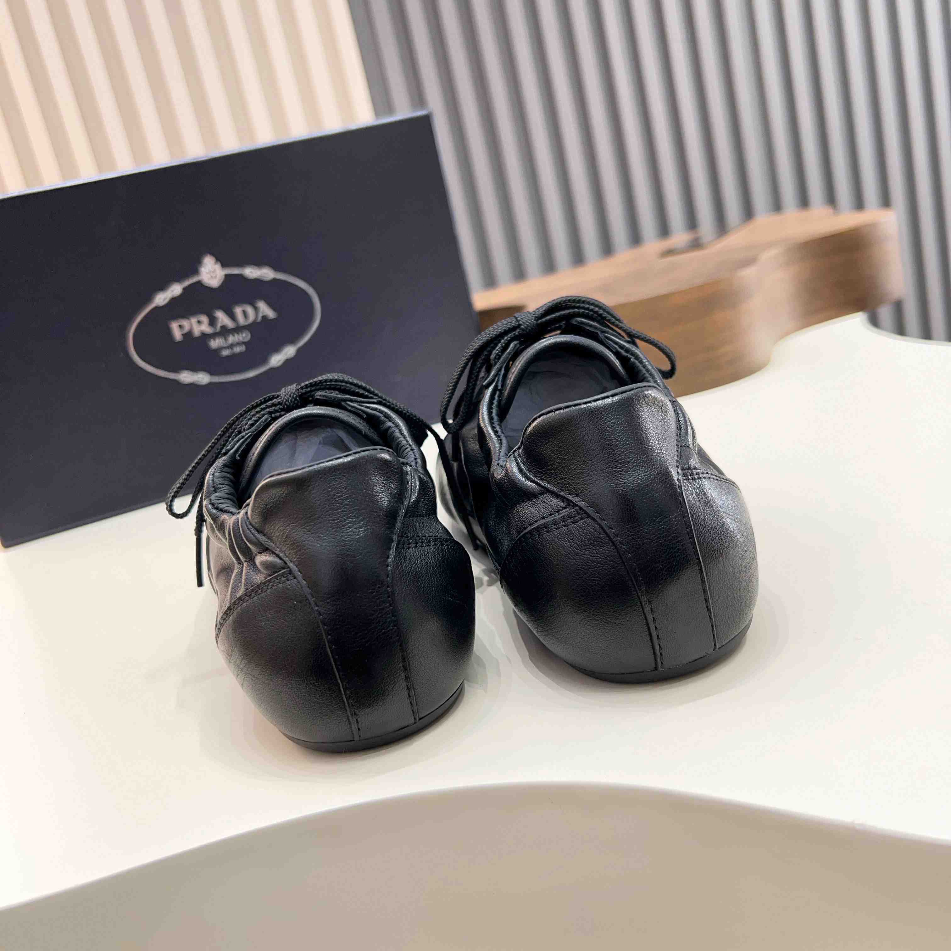 Prada Collapse Leather Sneakers - DesignerGu