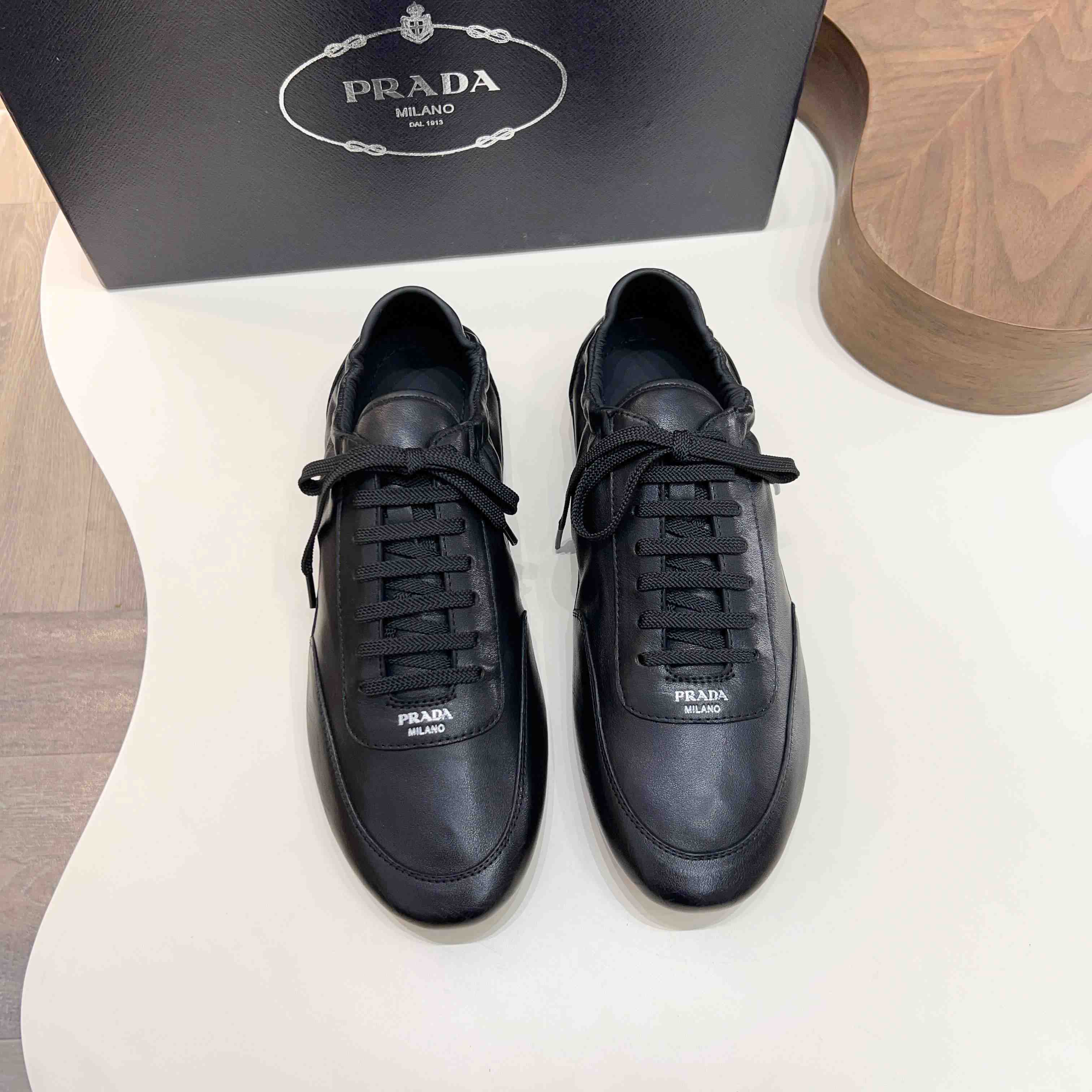 Prada Collapse Leather Sneakers - DesignerGu